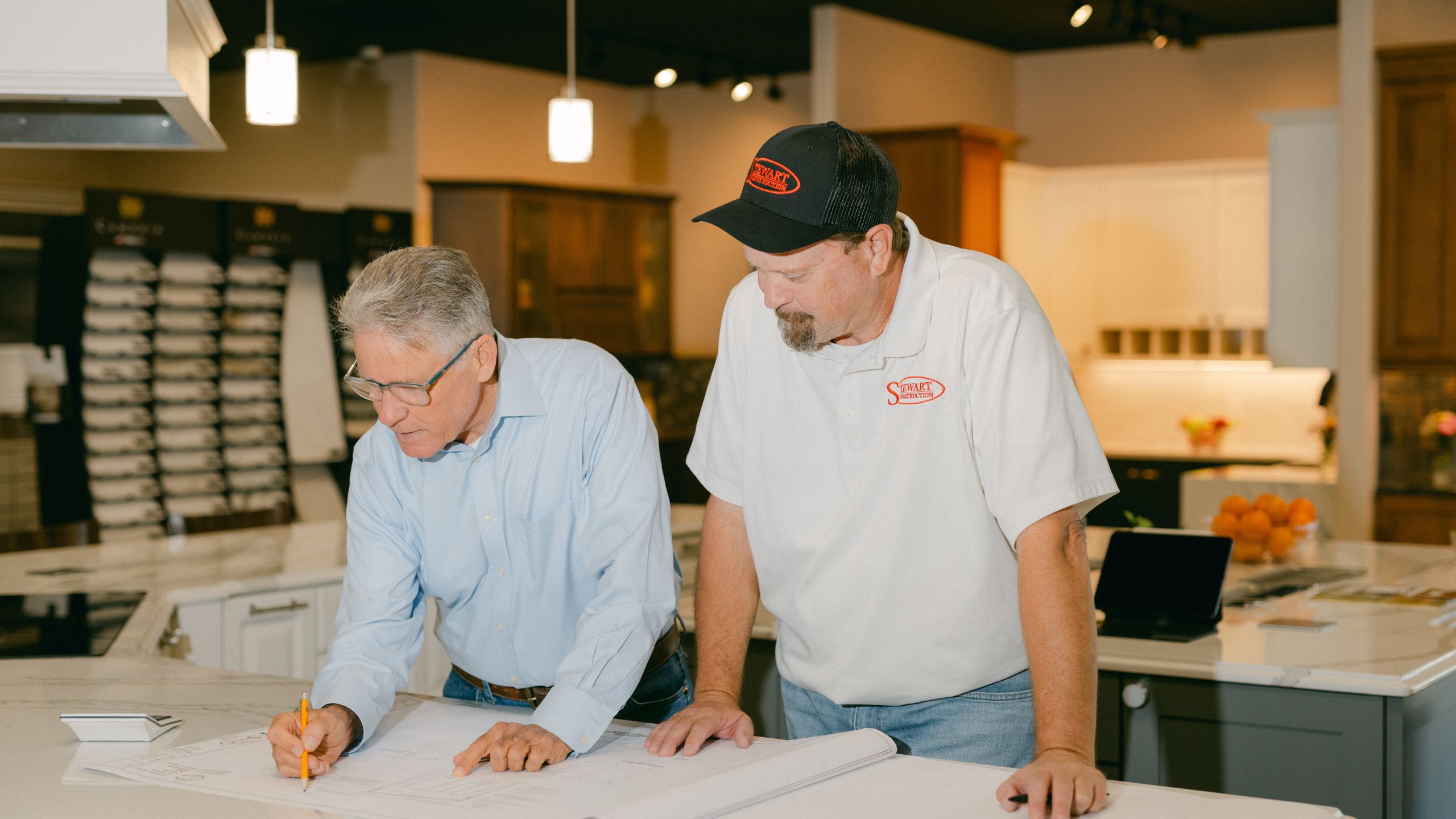 Stewart Construction team reviewing remodeling plans in Sebring, FL
