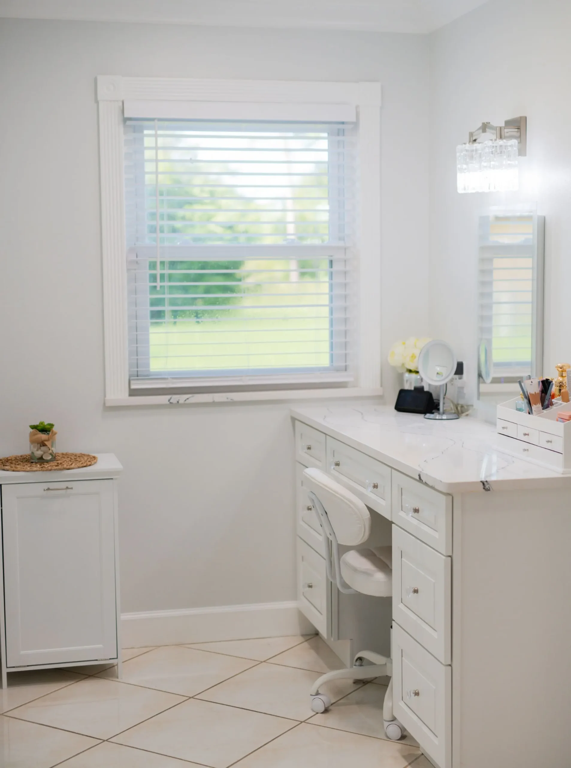 white vanity in a makeup room in a primary bathroom suite