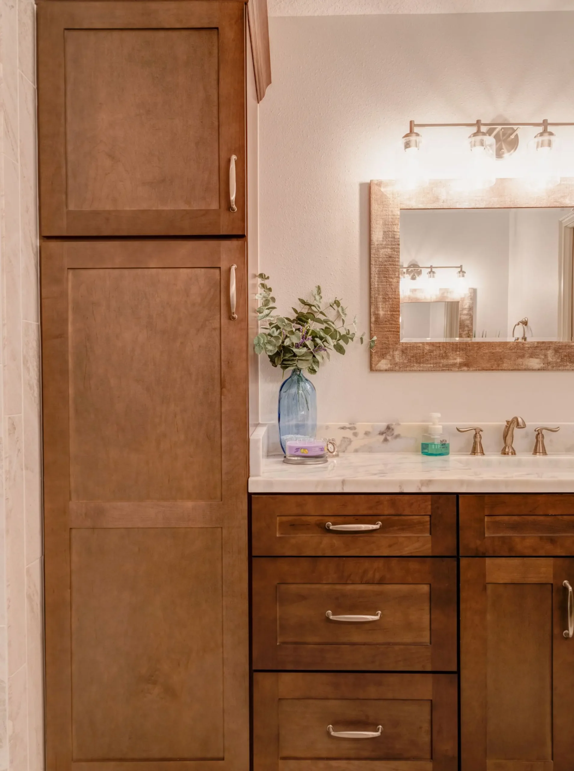 Built-in linen cabinet providing bathroom storage