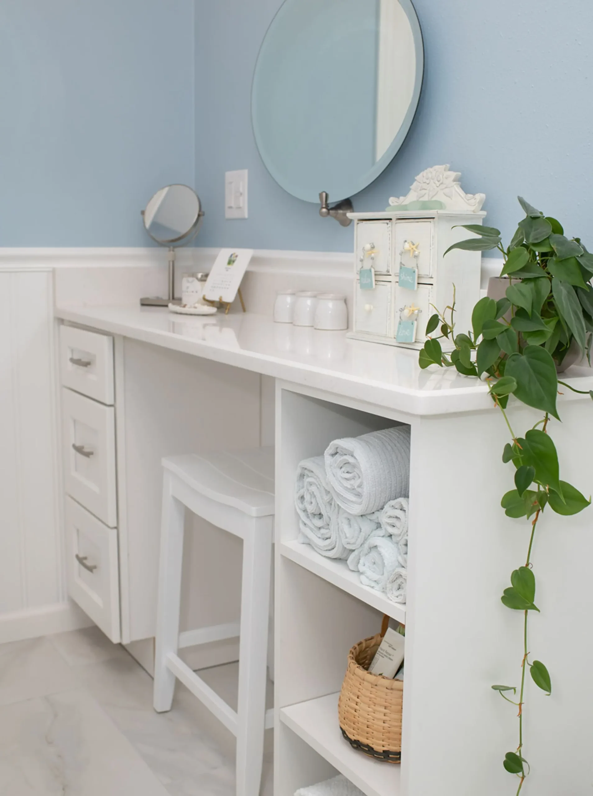 Bathroom makeup vanity with dedicated seating area